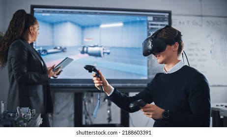 Black Teacher Typing on Tablet and Supervising While Her Student Wearing VR Headset and Using Controllers. Virtual Reality Technology For Industrial Design, Development, Prototyping in CAD Software. - Powered by Shutterstock