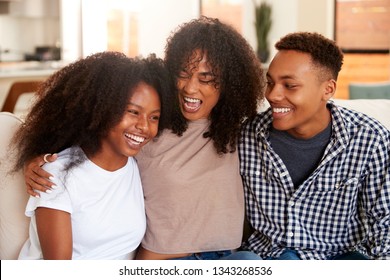 Black Teen And Young Adult Brother And Sisters Relaxing Together, Close Up