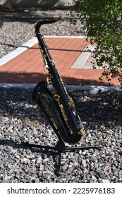 Black tenor sax on stand - Shutterstock ID 2225976183