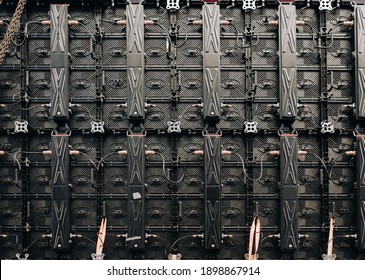 Black Texture Of LED Panels Back View. Large Monitor Screen For Demonstration Of A Street Concert. A Complex System Of Wires And Contacts. Modern Technology Concept.