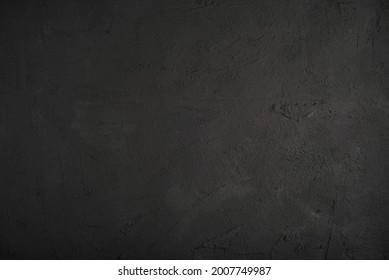 Black textured concrete rich background