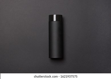 Black Thermos Cup On Black Background.