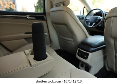 Black Thermos In Holder Inside Of Car