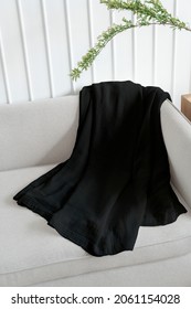 Black Throw Blanket On A Sofa