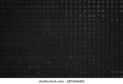 Black tile wall high resolution real photo or brick seamless  pattern and texture interior room background. Dark grid tiles wall texture for the decoration of the bedroom, Home or office backdrop.