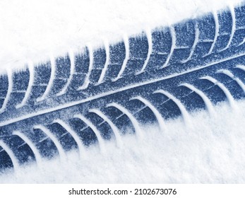 black tire on white snow after snowfall                               