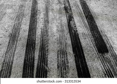 black tire tracks on road