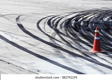 Black tire tracks on road