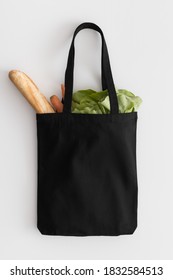 Black Tote Bag Mockup With Groceries On A White Table.