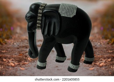 Black Toy Elephant In Front Of A White Background