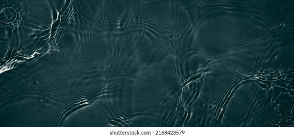 Black transparent clear calm water surface texture with ripples, splashes. Abstract nature banner background. Dark grey water waves. Copy space, top view. Cosmetic moisturizer micellar toner emulsion - Powered by Shutterstock