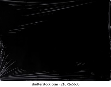 Black transparent plastic wrap texture overlay background. Realistic plastic for poster design and photo overlay effect. Wrinkled plastic surface pattern for graphic design sources and element. - Shutterstock ID 2187265635