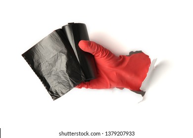 Black trash bag in hand in protective glove on white background. - Powered by Shutterstock