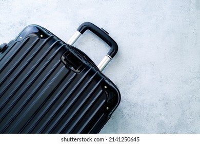 black travel bag,Black luggage set on dark background, top view image, flat lay composition. Travel minimalist concept, black and dark classic baggage mockup, small and big. Suitcase accessory set - Shutterstock ID 2141250645