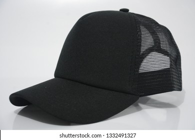 A Black Trucker Cap In A White Background.