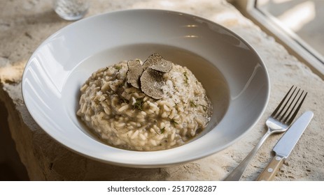 Black Truffle Risotto: Creamy risotto infused with the earthy, luxurious flavor of black truffles, finished with Parmesan and a drizzle of truffle oil for extra decadence.






 - Powered by Shutterstock