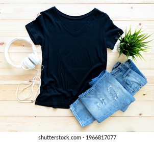 Black Tshirt Mockup And Short Jeans On Brown Wooden Background. Template, Flat Lay 