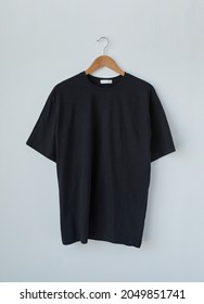 Black Tshirt Template On Hanger Ready For Your Own Graphics.