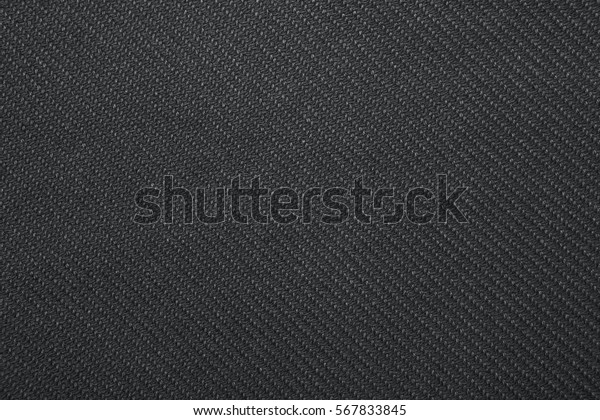 Black twill weave fabric pattern texture\
background closeup