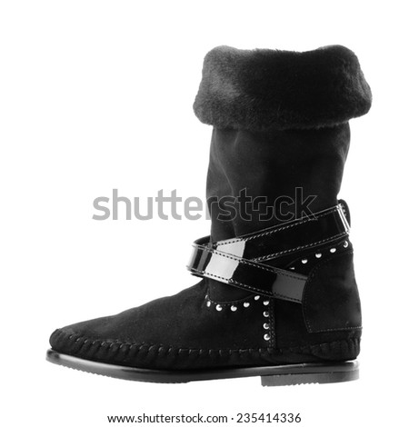 Black ugg boot isolated on white background.
