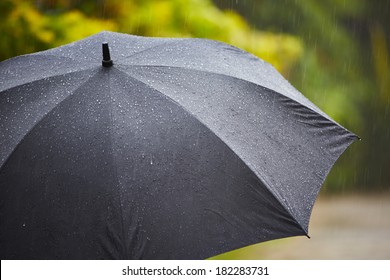 Black Umbrella In Heavy Rain - Selective Focus