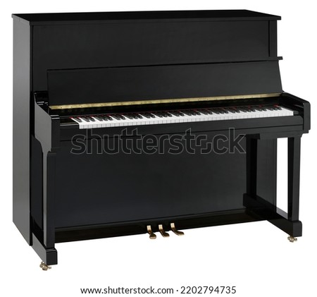 Black upright piano with clipping path.