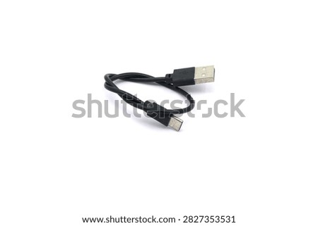 A black USB cable on a white background. A USB cable for data transfer.