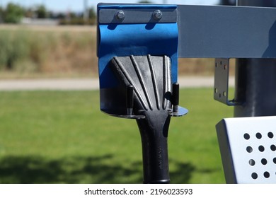 A Black Vacuum Cleaner Sits At A Cleaning Station In A Car Wash. 