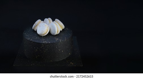 Black Velour Velvet Cake With White Macarons On Top And Gold Black Background