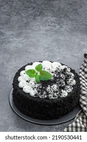 Black  Velvet Cake Decorated With White Cream On Gray Stone Background 