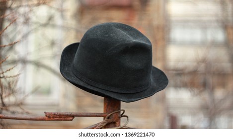 Black Velvet Hat On A Steel Pillar