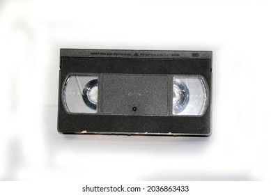 Black VHS Video Tape Without Box, See Inside Tape On White Background, Isolated.