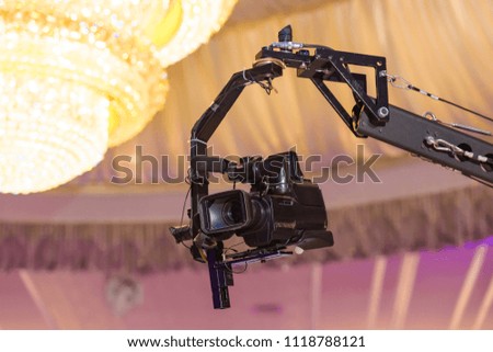 Black video camera on the tap. Professional video shooting. Holder for video stabilization