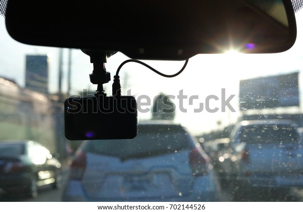 black video camera record technology on\
windscreen vehicle car\
driving