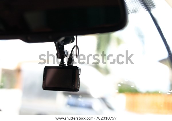 black video camera record technology on windscreen\
vehicle car