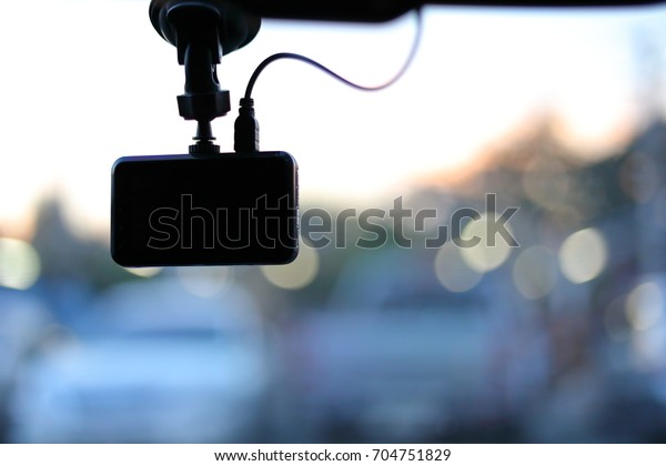 black video camera record technology on
windscreen vehicle car
driving