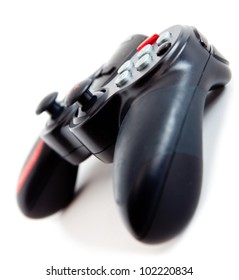 Black video game controller - isolated over a white background
