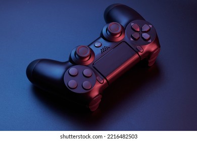 Black video game controller, joystick for game console isolated on black background. Gamer control device close-up - Powered by Shutterstock