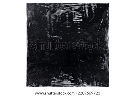 Black vinyl record cover wrapped in plastic isolated on white background with clipping path