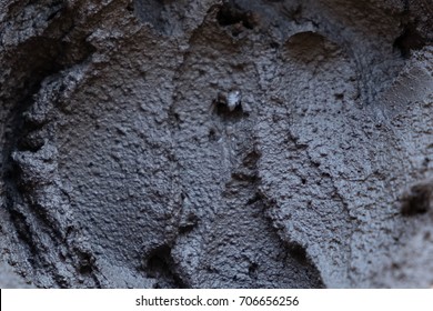 Black Volcanic Cosmetic Clay In A Bowl.  Texture Close Up. Solution Abstract Background