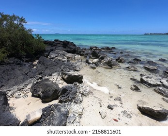 Black Volcanic Rock On Beach