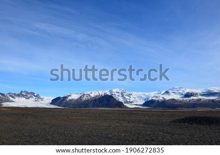 Similar – Image, Stock Photo Snow-covered mountain and Icelandic moss