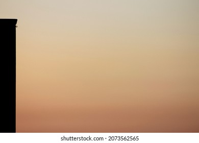 Black Wall Corner And Orange Sunset Background