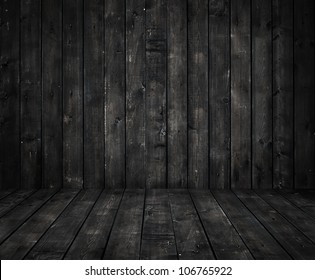 black wall and wooden floor