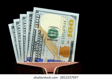Black wallet with a fresh stack of hundred-dollar bills, symbolizing wealth and financial stability. New 100 dollar bills, USD