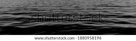 black water sea wave. black water banner and surface of dark nature background. Black water texture. ripple effect on surface sea water in black and white color. cover page.