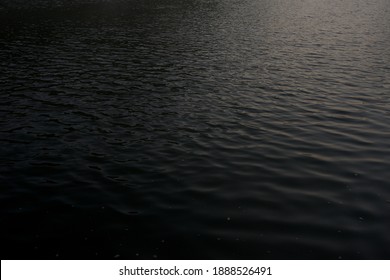 Black Water With Sunny Reflections Texture Background,Ocean Wavy Surface