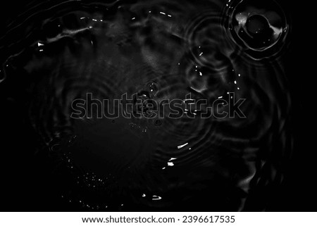The black water surface gives a feeling of calm and calm. Sometimes it feels firm and soft. Natural black water surface with abstraction.
