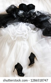 Black Wedding Shoes And Wedding Dress On The Bad