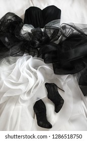 Black Wedding Shoes And Wedding Dress On The Bad